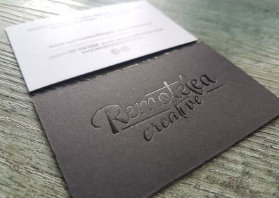 Premium black and white business cards for Remotelea Creative