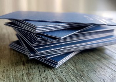 Navy and silver business cards with white seams