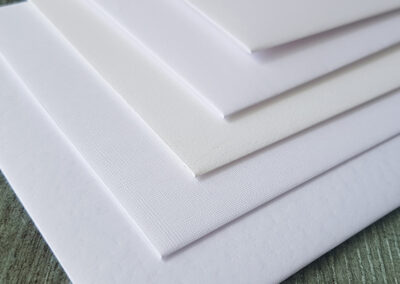 textured white envelope ranges